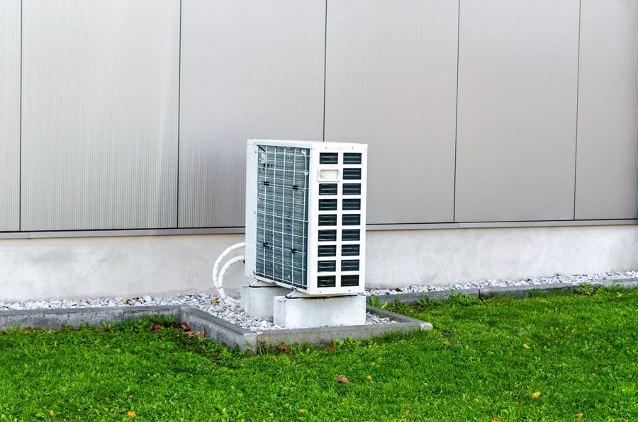 Air Conditioners Versus Heat Pumps. Image shows unit outside of home.